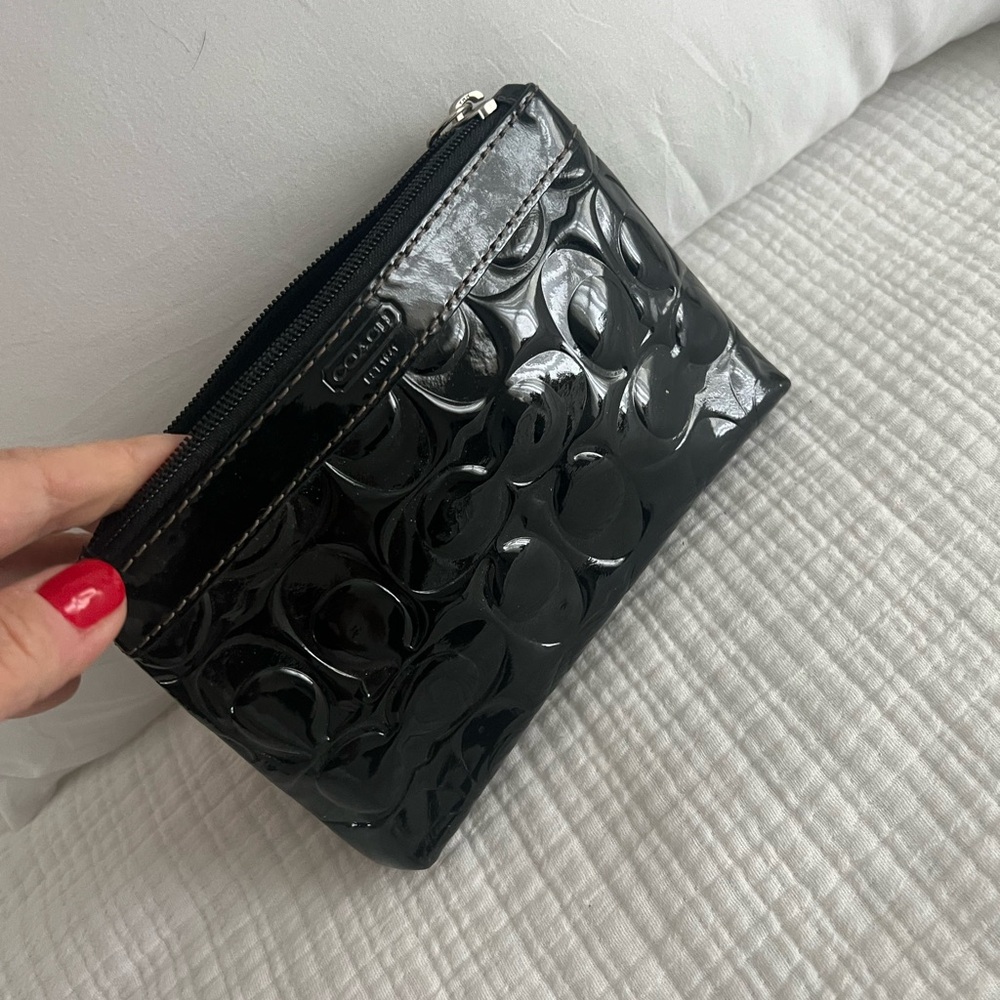 Coach Black patent leather Embossed Women's wristlet like new. No smells